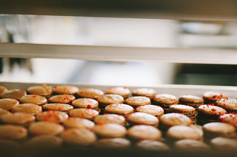 Macarons are the perfect gluten free treat! Always at least 12 different flavours at Yann Haute Patisserie, authentic French bakery and pastry shop in a big yellow house filled with cakes, macarons, croissants & bread.