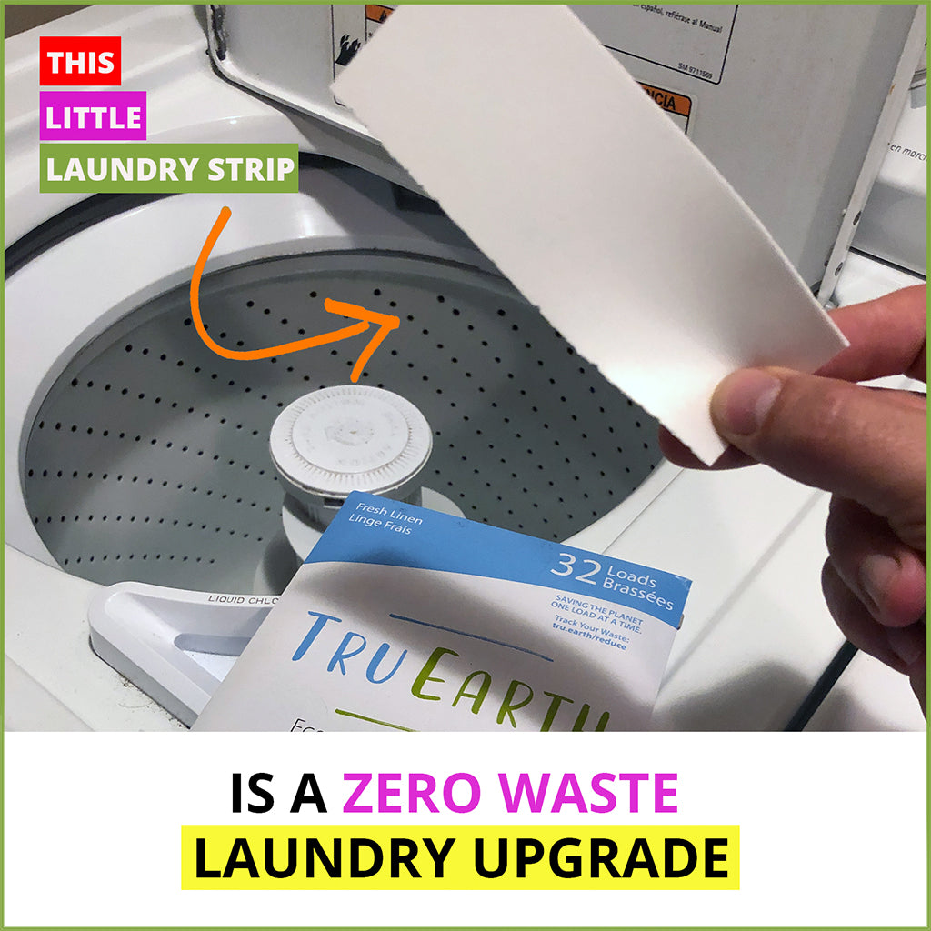 inserting a Tru Earth Eco-Strip into a washer