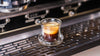 Picture of a fresh espresso sitting on espresso machine drip tray.