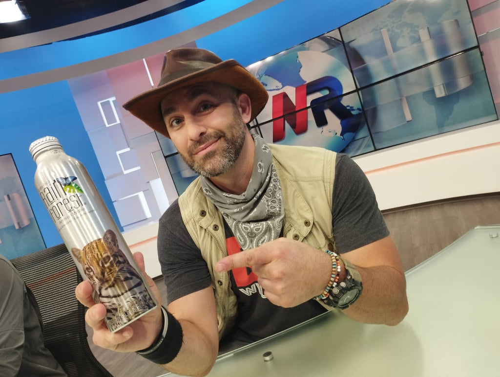 Coyote Peterson from Animal Planet's Brave the Wild show with an aluminum water bottle of RainForest Water in Costa Rica