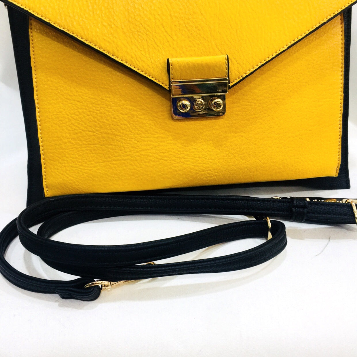 black and yellow clutch bag