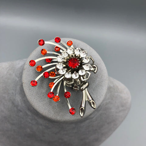 Firecracker brooch after restoration