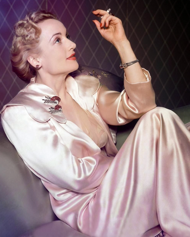 Carole Lombard wearing a pair of dress clips