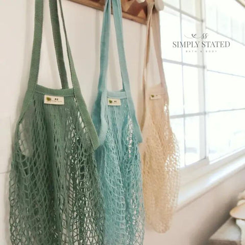 One-Tripper Mesh Market Bag showing all color options in sage green, blue, and cream. Large bags equivalent to 4 plastic shopping bags.