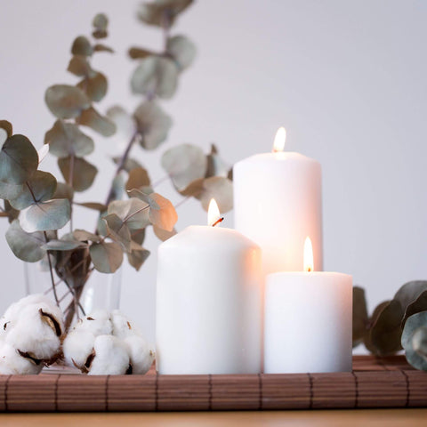 Image of hygge with candles and eucalytpus