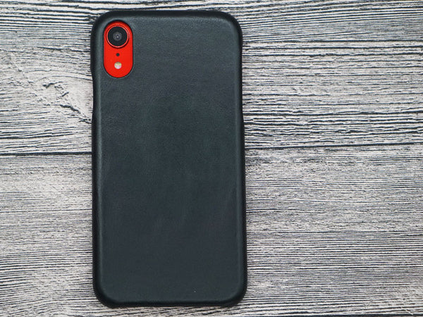 Red iPhone XR with black leather case