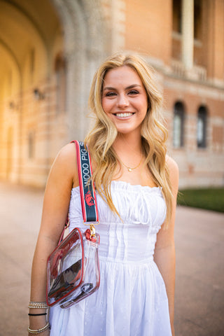 college fan with clear game day purse with printed purse strap for arkansas razorbacks