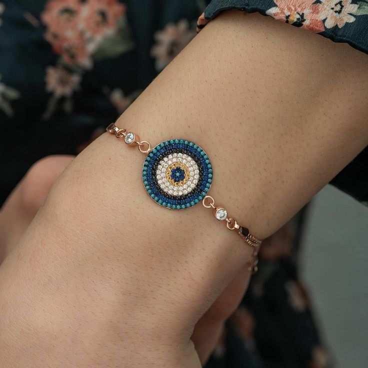 gold bracelet with evil eye