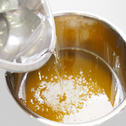 Making Soap adding Sodium Hydroxide to oils