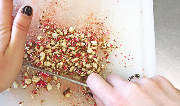 Chopped pieces of Valentine's Day sprinkle chocolate covered pretzels