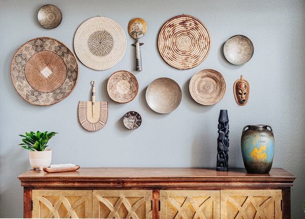 gallery wall with african baskets and wood masks