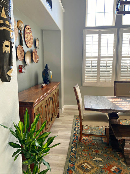 dining room decorated with wood masks