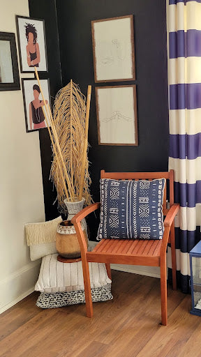 living room with black paint and african art