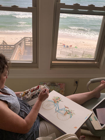 Pam Coxwell painting Draw Near Bicycle at beach