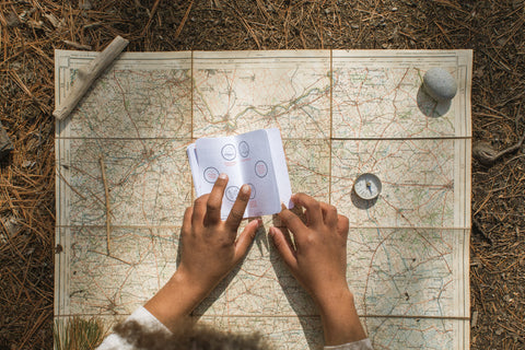 Image showing a child's hands using a map compass.