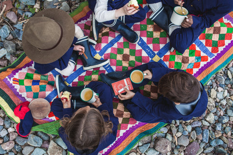 Children enjoying a picnic at the forest school. 