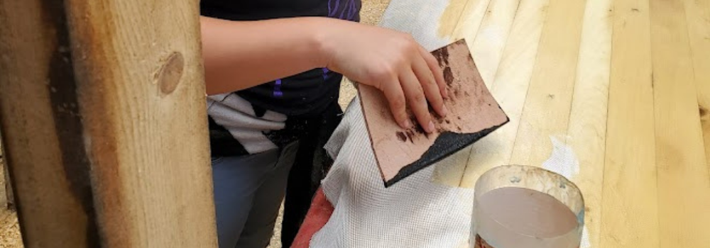  Applying fiberglass to paddleboard