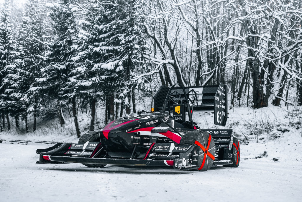 AutoSock mounted on front wheels of racing car Luna on snow in 2019