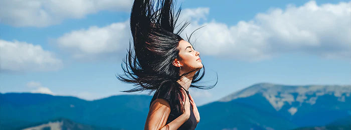 Girl is flipping her hair in wind