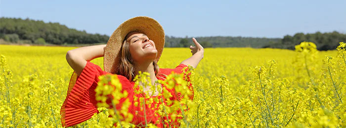 A woman is enjoying at the yellow flower farm