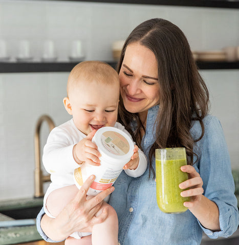 Majka Co-founder Holding Baby and Smoothie
