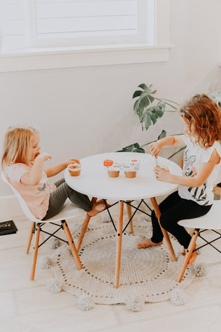 Girls eating organic biodynamic baby food