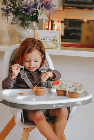 Baby eating biodynamic baby food