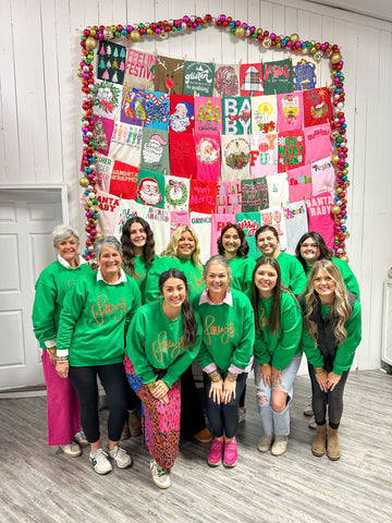 Pictured are a group of girls in green sweatshirts.