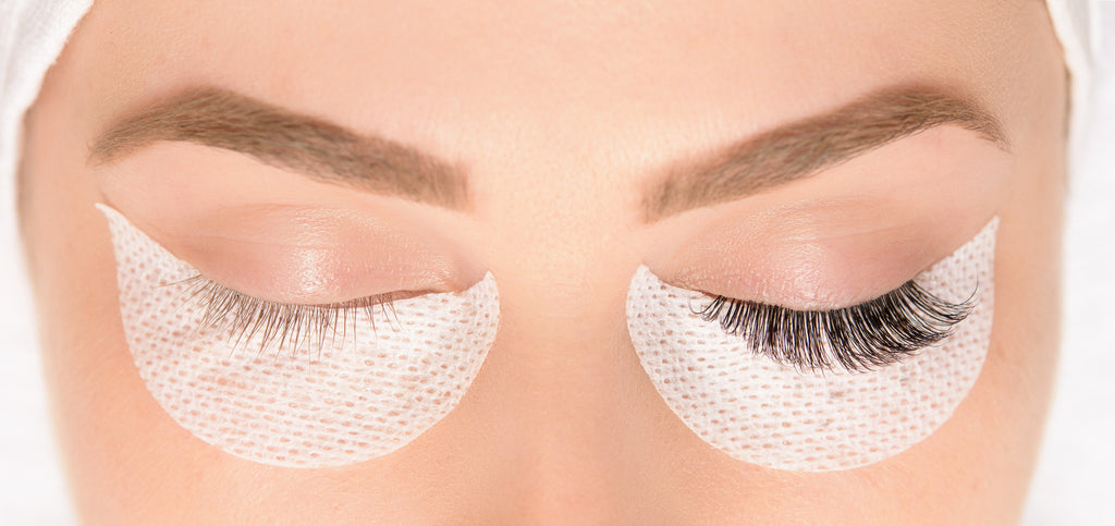 Close-up of woman’s face with eye on the left having natural lashes and eye on the right having double layer pro-made fans.