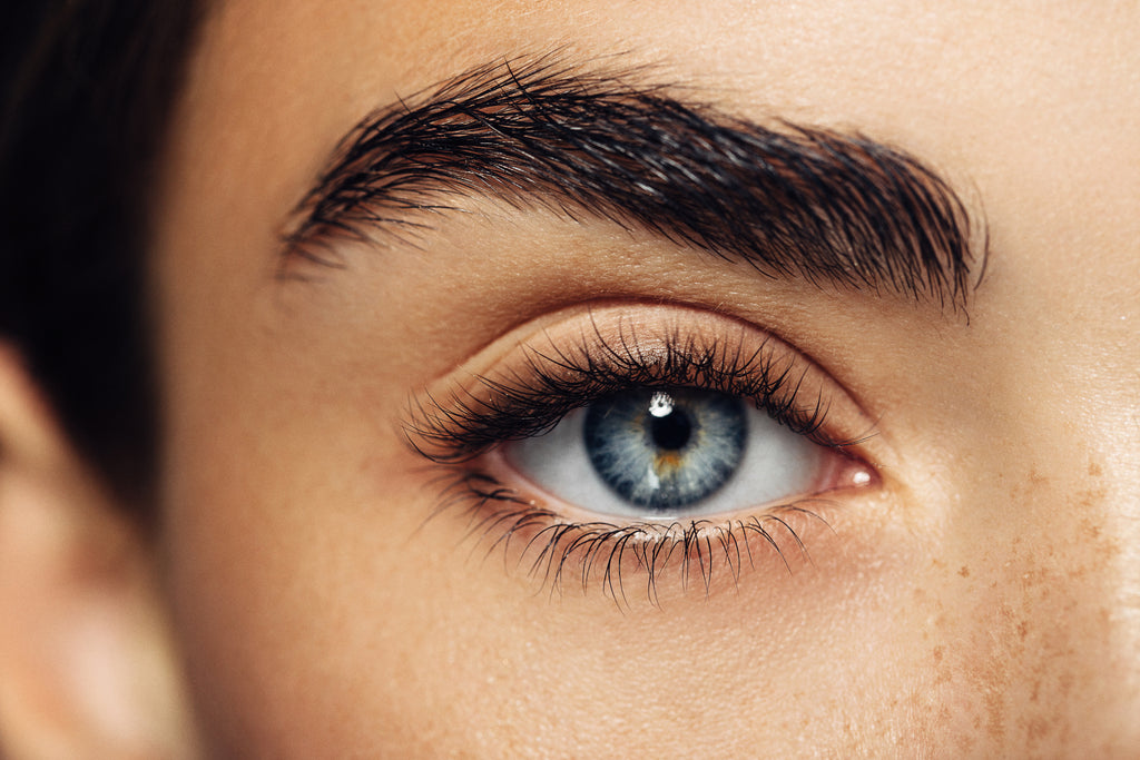 Close-up of woman’s eye with natural-looking eyelash extensions.