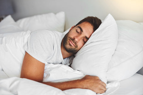 man sleeping in bed