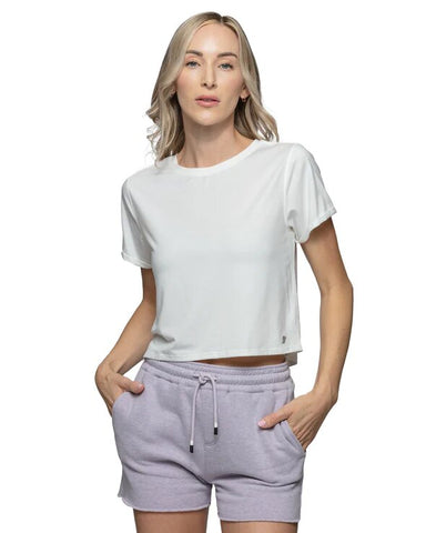 Woman in a white t-shirt and grey shorts