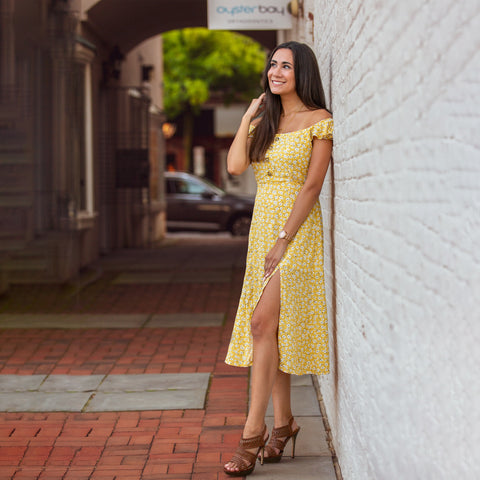 Woman in a yellow floral dress