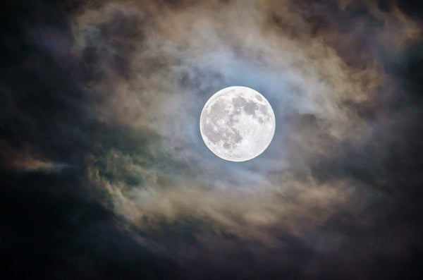 full moon in a hazy night sky