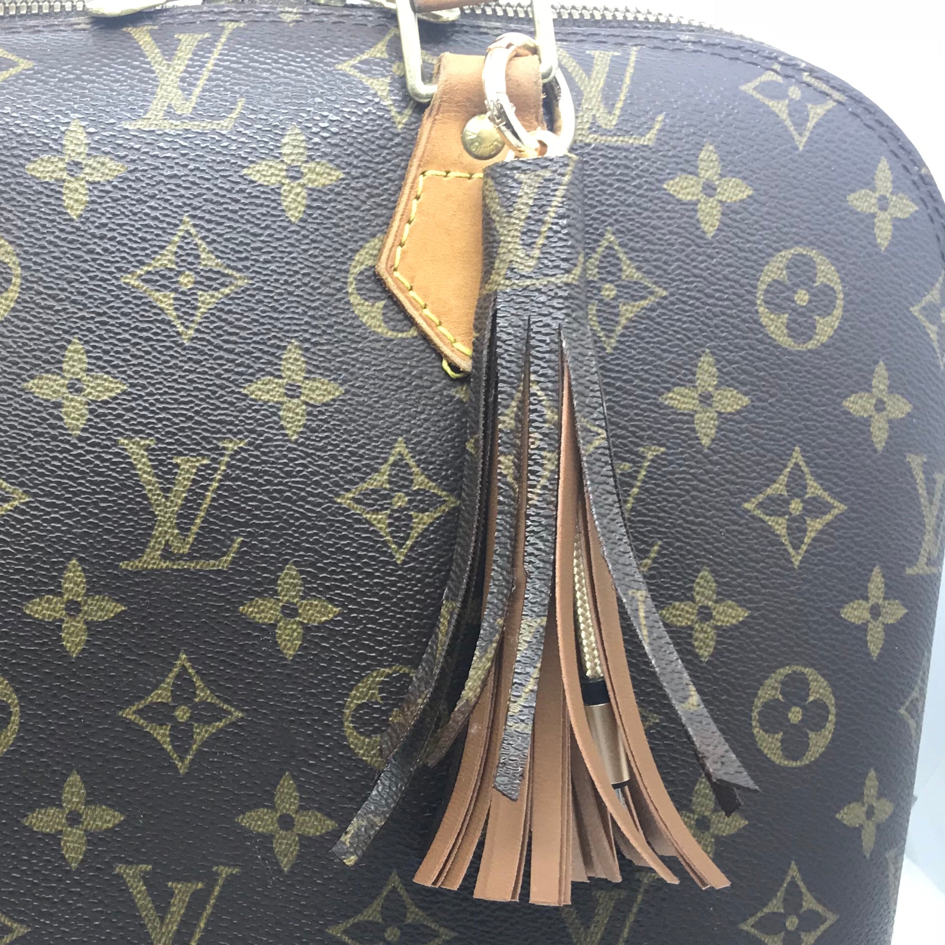 Louis Vuitton leather handles refurbishment lighten and even patina