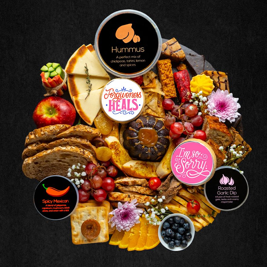 Platter Planet's "I'm Sorry" Platter is the perfect way to express your sincerest apologies. It is sure to make a memorable statement that conveys your most heartfelt sentiments.  This platter includes; assorted dessert slices including a mini lava cake, fresh seasonal fruit, hummus with pita, dips, breads and crackers, and customized “sorry” cookies.