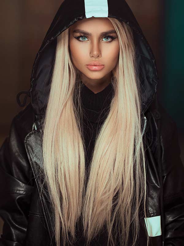 Weftbar Hair Extensions: Woman with long, straight blonde hair wearing a black hoody jacket
