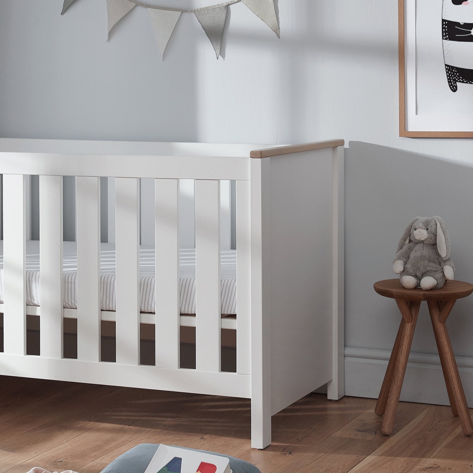 white cot bed with mattress