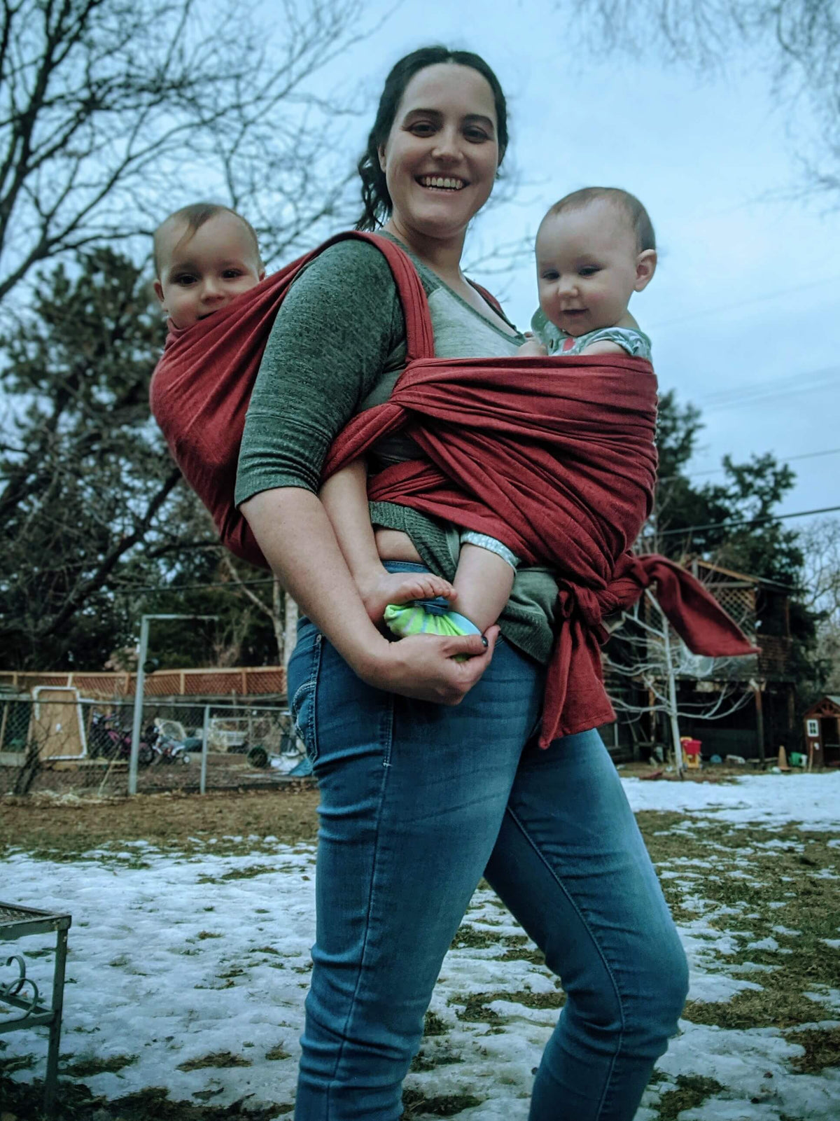 woman wearing two children tandem in a woven wrap  