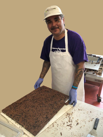 Boulder company baking brownies at Community Table Kitchen. As seen in Fast Company!