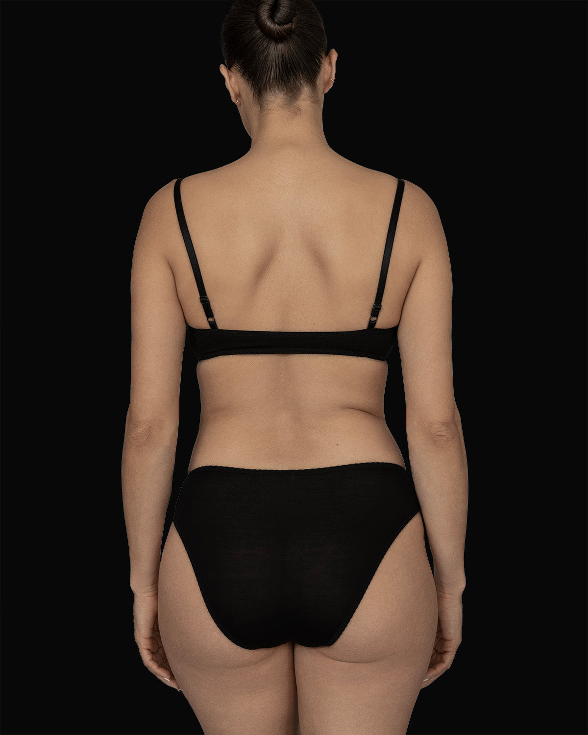 The Kye Intimates Recline Bra in the color Black. A gentle, pullover scoop neck bra, with adjustable shoulder straps. A double layered bamboo bra that is designed to provide maximum comfort.
