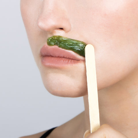 Woman waxing upper lip with Parissa Hot Wax
