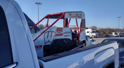 Midget racecar in bed of pick-up truck