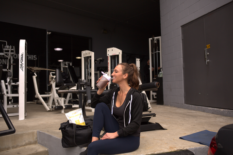 girl drinking from a shaker bottle