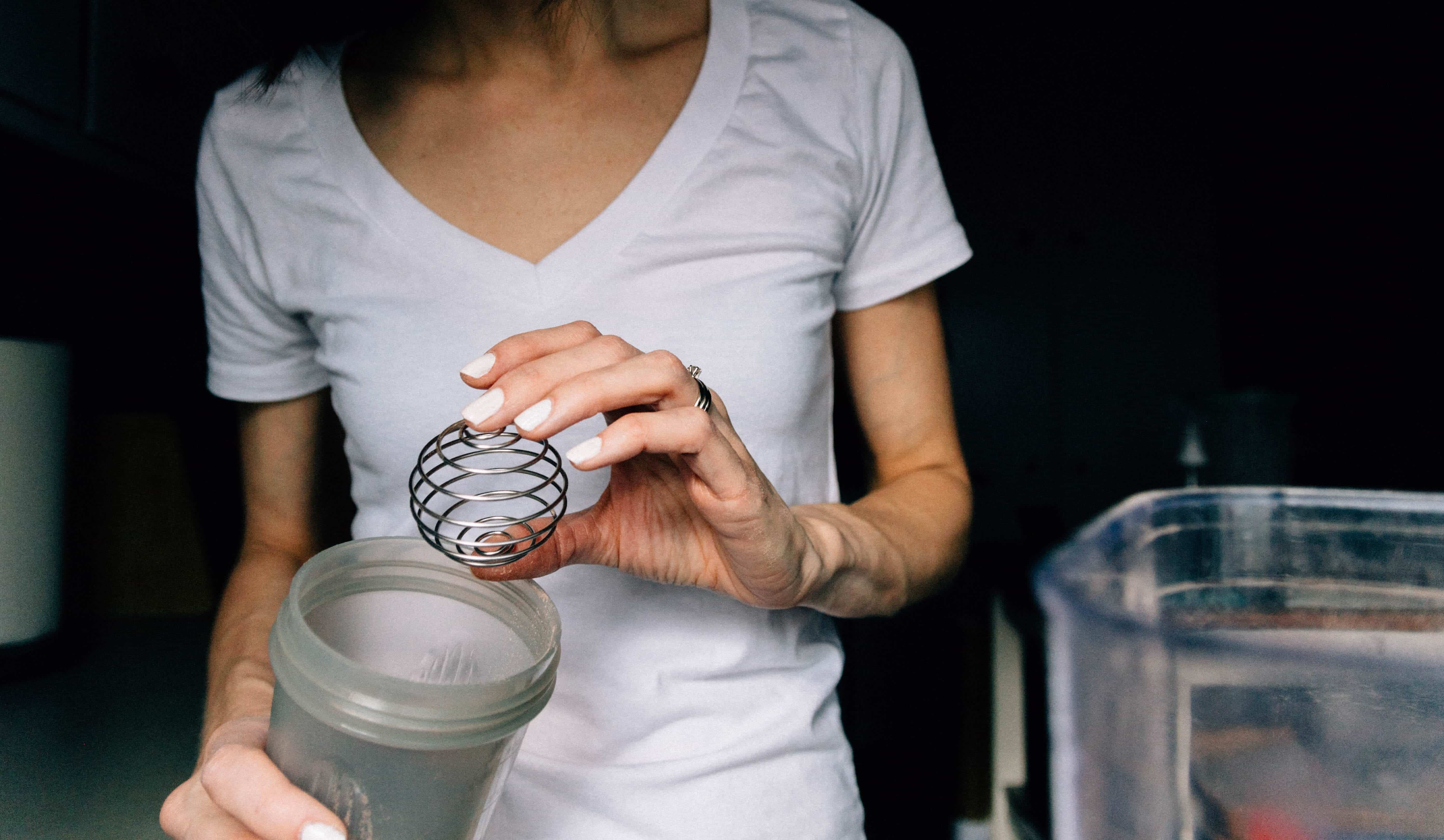 Girl holding blender bottle