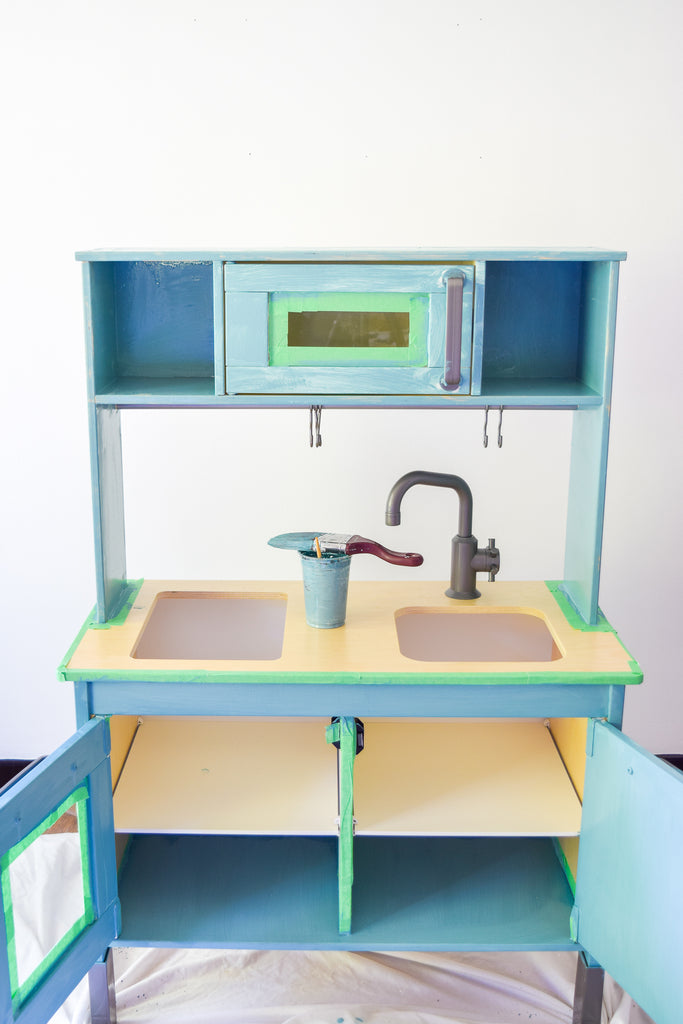 Give the IKEA DUKTIG Play Kitchen a makeover with  milk paint.
