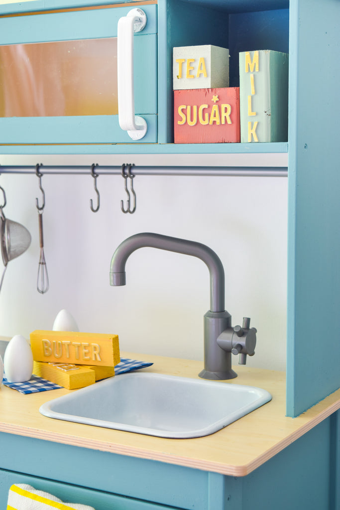 Give the IKEA DUKTIG Play Kitchen a makeover with milk paint.