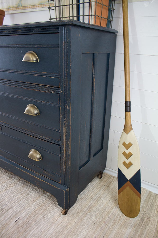 Antique dresser painted in black chalk paint, distressed and