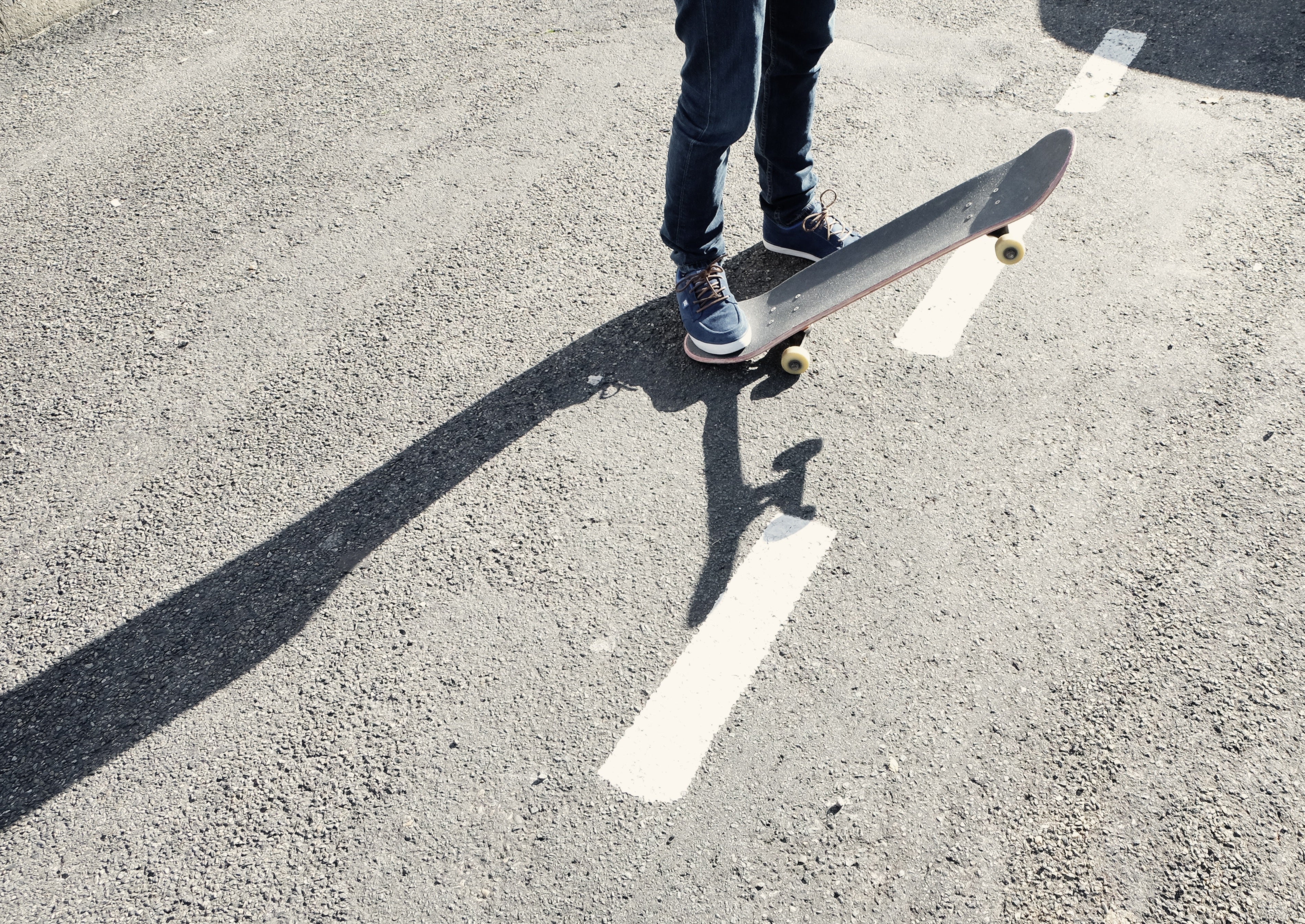 Skateboard In Parking Lot