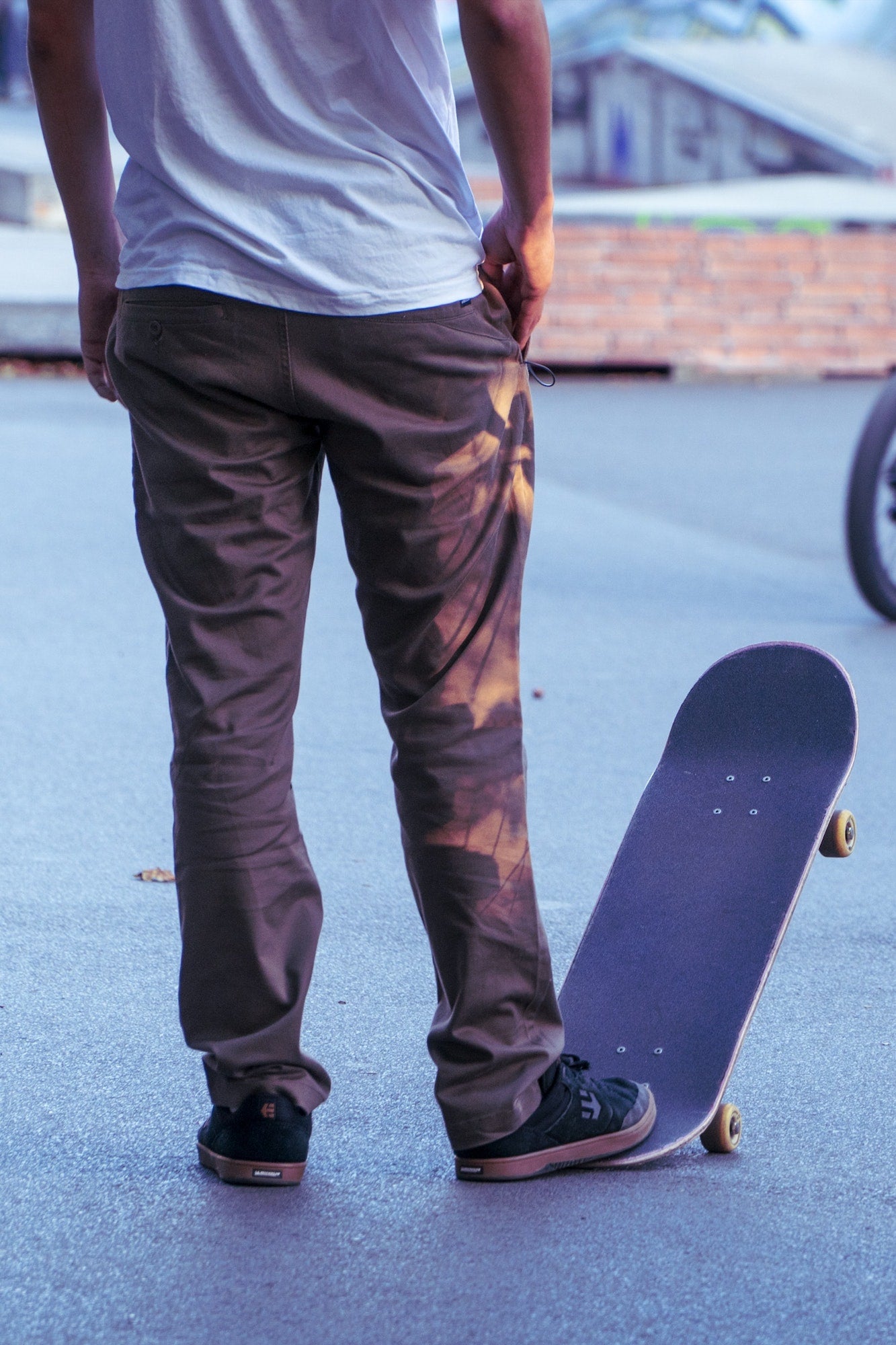 Skateboarder Holding Board